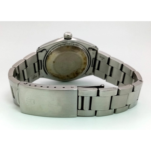 338 - A Rolex Oyster Perpetual Automatic Gents Watch. Stainless steel strap and case - 35mm. Silver tone d... 