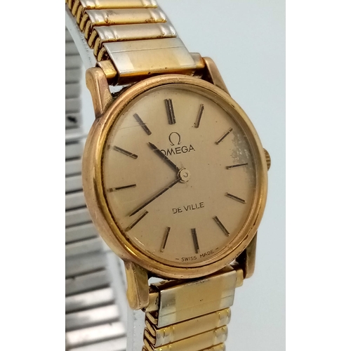 379 - An Omega Deville Quartz Ladies Watch. Expandable comfort gilded bracelet. Case - 25mm. Gold tone dia... 