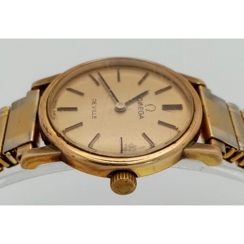 379 - An Omega Deville Quartz Ladies Watch. Expandable comfort gilded bracelet. Case - 25mm. Gold tone dia... 