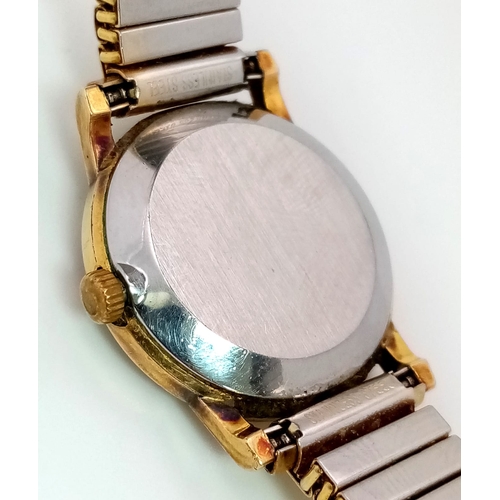 379 - An Omega Deville Quartz Ladies Watch. Expandable comfort gilded bracelet. Case - 25mm. Gold tone dia... 