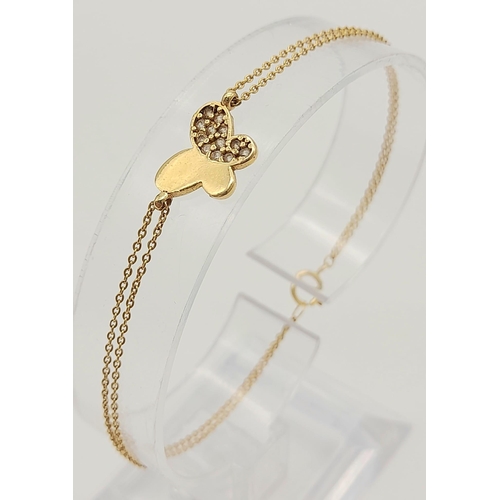 385 - 18K YELLOW GOLD DOUBLE ROW STONE SET BUTTERFLY BRACELET. TOTAL WEIGHT 2.1G. 18CM IN LENGTH.