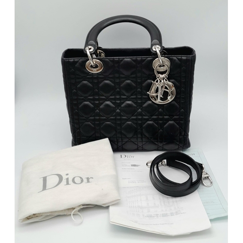 59 - The Season's Lady Dior bag by Christian Dior is crafted from black quilted Lambskin leather. The int... 