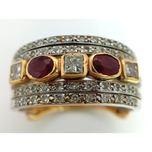 11 - A Statement 18k Yellow, White Gold and Gemstone Band Ring.  A Central reservation of oval rubies and... 