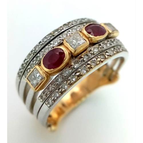 11 - A Statement 18k Yellow, White Gold and Gemstone Band Ring.  A Central reservation of oval rubies and... 