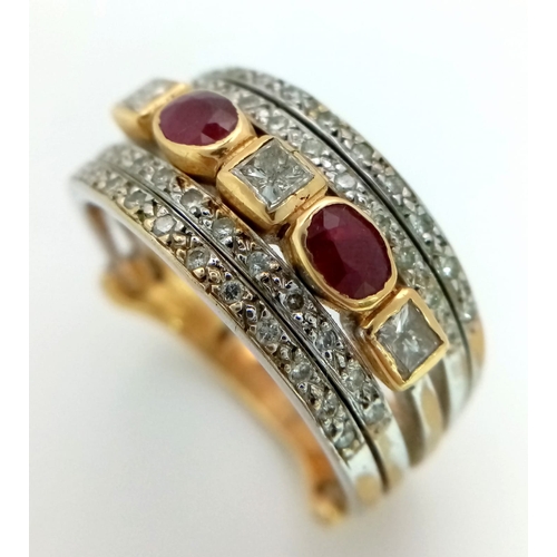 11 - A Statement 18k Yellow, White Gold and Gemstone Band Ring.  A Central reservation of oval rubies and... 