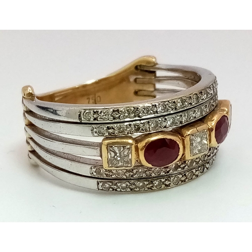 11 - A Statement 18k Yellow, White Gold and Gemstone Band Ring.  A Central reservation of oval rubies and... 