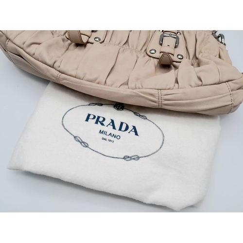 169 - A PRADA BEIGE NAPPA LEATHER GAUFRE POMICE TOTE BAG. SILVER TONE HARD WEAR INCLUDING BUCKLE DETAIL. T... 