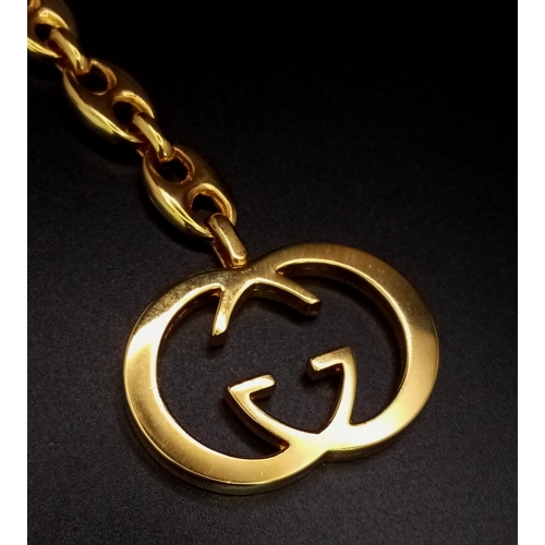 365 - A Gucci Gold Plated Interlocking Keychain. This well constructed Gucci logo keychain is 12cm in tota... 