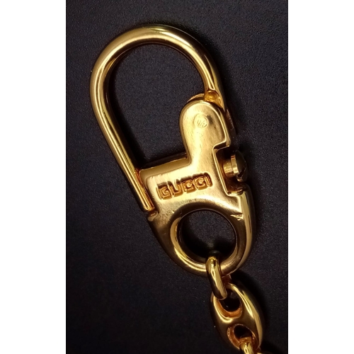 365 - A Gucci Gold Plated Interlocking Keychain. This well constructed Gucci logo keychain is 12cm in tota... 