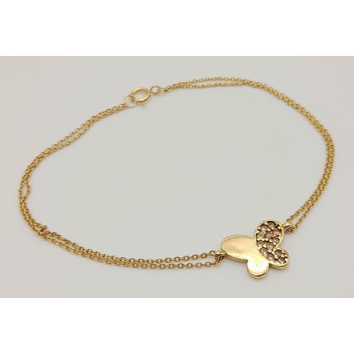 385 - 18K YELLOW GOLD DOUBLE ROW STONE SET BUTTERFLY BRACELET. TOTAL WEIGHT 2.1G. 18CM IN LENGTH.