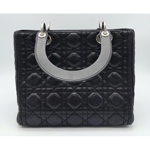 59 - The Season's Lady Dior bag by Christian Dior is crafted from black quilted Lambskin leather. The int... 