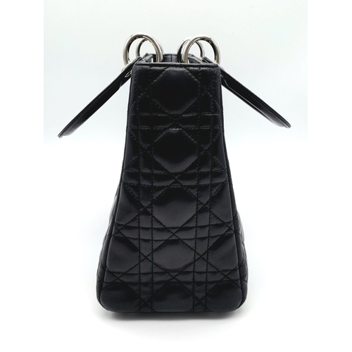 59 - The Season's Lady Dior bag by Christian Dior is crafted from black quilted Lambskin leather. The int... 