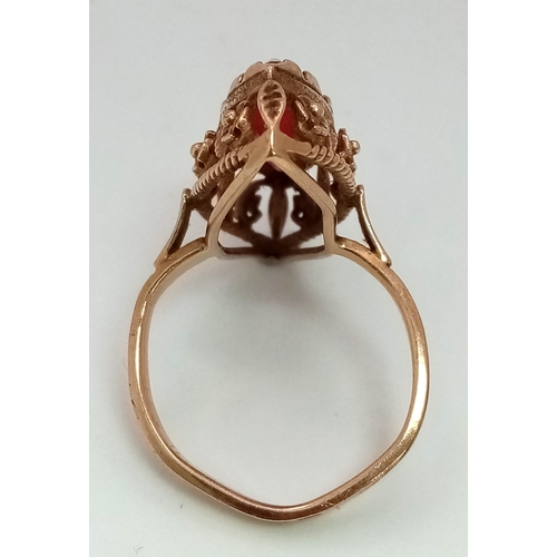 86 - A 14K gold Ruby ring with nicely ornate decoration. Total weight 6.63 grams. Size Q. 13698