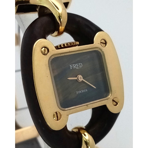 282 - A  very rare Fred of Paris 18K Gold Ladies Watch. Black leather and gilded metal bracelet. 18k gold ... 