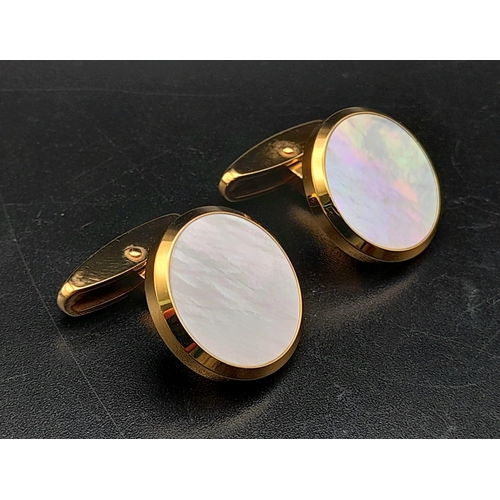 317 - A Pair of Chopard 18k Gold and Mother of Pearl Cufflinks. Comes with a certificate of origin and ori... 