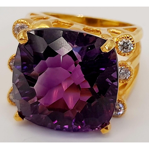 140 - A very glamorous, sterling silver and gold ring with a large, cushion cut, quality amethyst (17 x 17... 