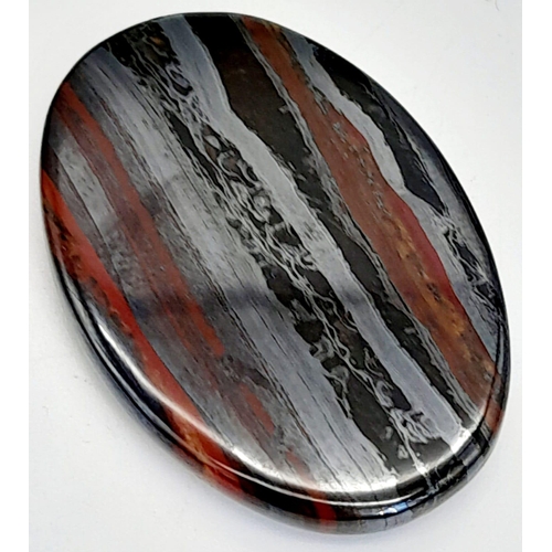 224 - A palaeontological gem, a BANDED IRON FORMATION oval cabochon from Western Australia. Dimensions: 38... 