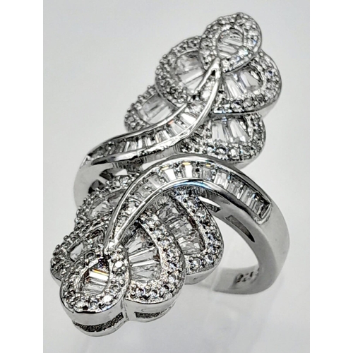 238 - A stylish, sterling silver ring with rose and baguette cut cubic zirconia. Ring size: N, weight: 7.6... 