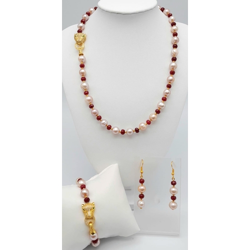 105 - A very attractive, pink pearl and faceted ruby necklace, bracelet and earrings set with PANTHER clas... 