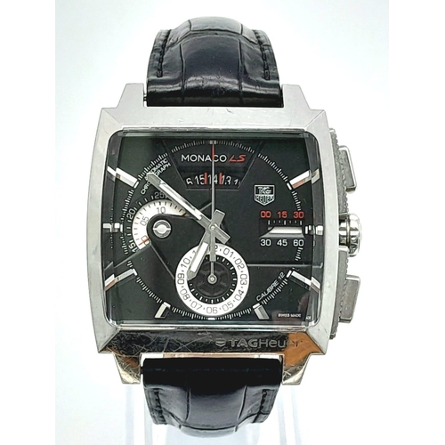 114 - A Tag Heuer Monaco LS Automatic Gents Chronograph Watch. Black leather strap with Tag clasp. Stainle... 