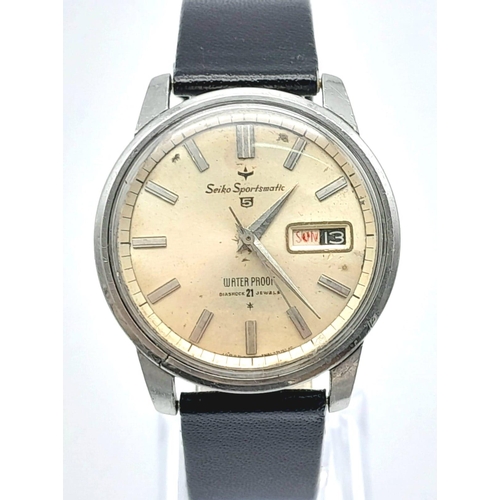 95 - A Rare Vintage Seiko 5 Sportsmatic Gents Watch. 21 jewels, black leather strap. Stainless steel case... 