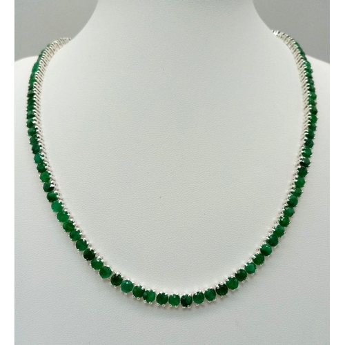 76 - A Beautiful Emerald Tennis Necklace. Set in 925 silver. 44cm