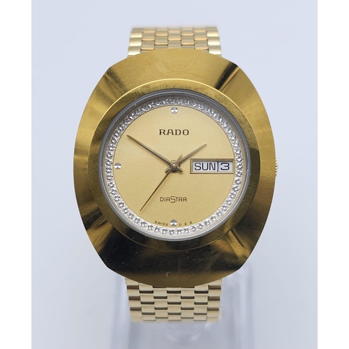 A Gold Plated Rado Diastar Unisex Watch. Gold plated bracelet and case 36mm. Gold tone dial with d