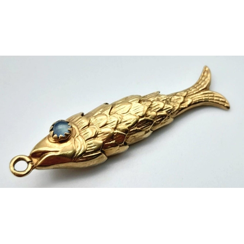 45 - A Vintage 9k Yellow Gold Articulated Fish Pendant/Charm with Aquamarine Eyes. 4cm. 3.11g weight.