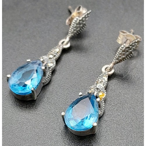 1684 - A Pair of 925 Silver And Blue Stone Drop Earrings. Total Weight 3.37g