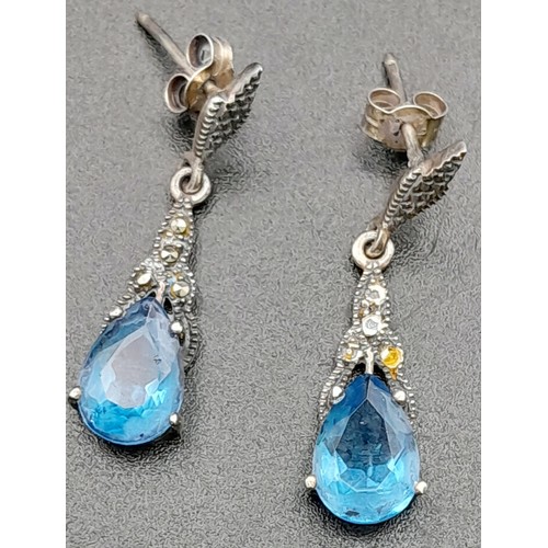 1684 - A Pair of 925 Silver And Blue Stone Drop Earrings. Total Weight 3.37g