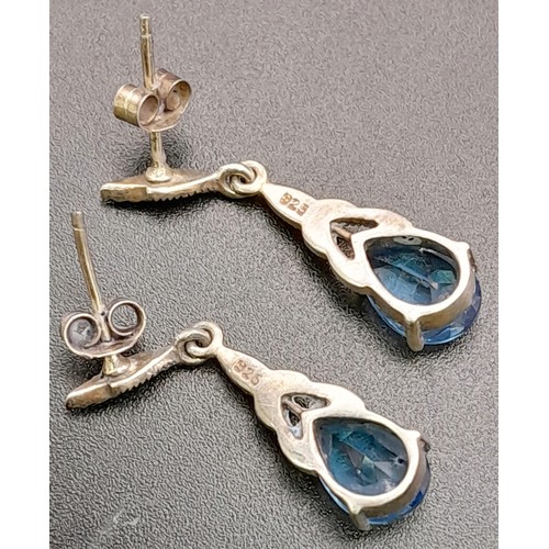 1684 - A Pair of 925 Silver And Blue Stone Drop Earrings. Total Weight 3.37g