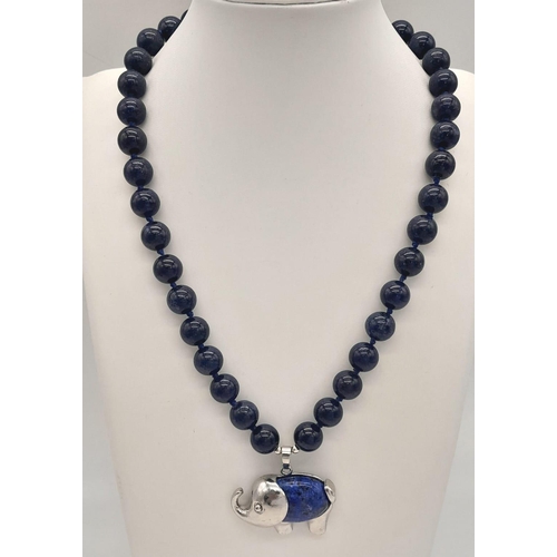 1685 - A Lapis Lazuli Elephant Pendant on a Lapis Necklace. Pendant - 4cm. Necklace - 42cm. Beads -10mm.