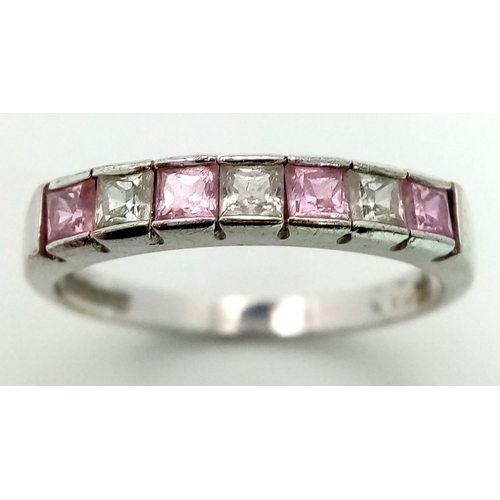 1699 - A 9K WHITE GOLD STONE SET BAND RING. TOTAL WEIGHT 2.2G. SIZE N/O.