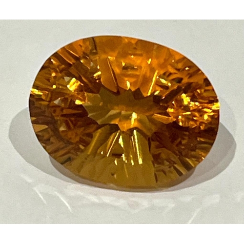 1686 - An 18ct Cognac Coloured Citrine Oval Cut Gemstone with a Trillion Base. No visible marks or inclusio... 