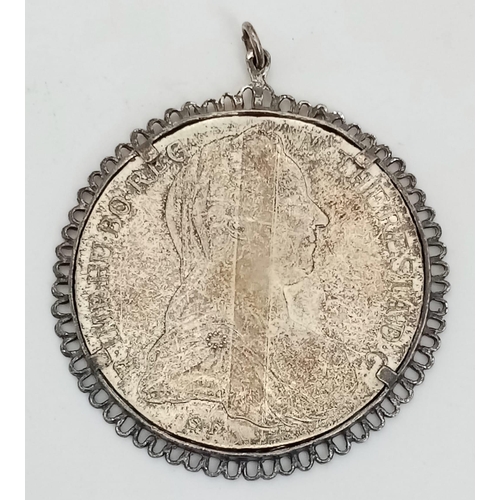 1694 - A Mother Theresa Silver Coin Pendant. Total Weight 34.82g. 4.5cm in diameter.