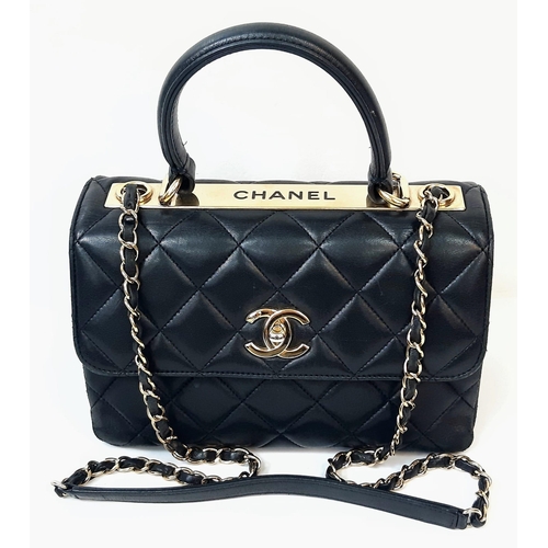 263 - A Stylish Chanel Top-Plate Hand/Shoulder Flap Bag. Quilted soft black leather. Gold tone hardware wi... 