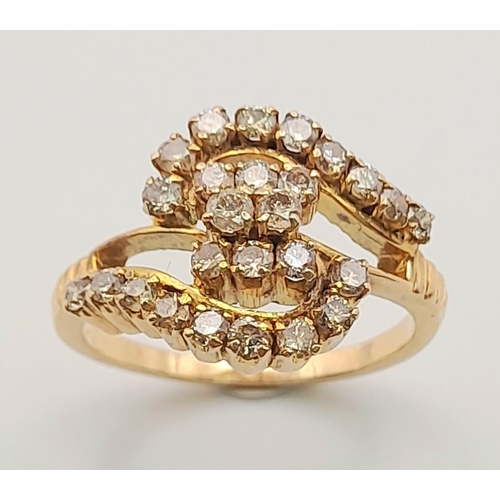 144 - A 18K ROSE GOLD 0.60CT DIAMOND CLUSTER CROSS OVER RING. TOTAL WEIGHT 4.4G. SIZE O.