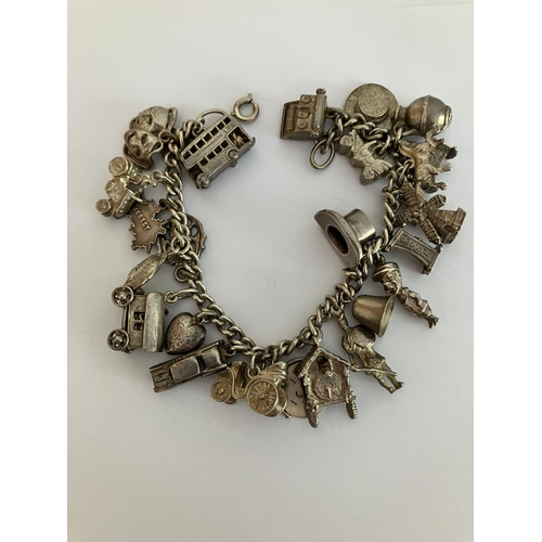 167 - Vintage SILVER CHARM BRACELET Absolutely smothered in silver charms to include cuckoo clock, vintage... 