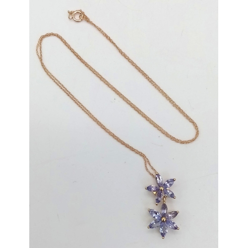 169 - An Unworn 9 Carat Yellow Gold & Tanzanite Set Double Flower Design Pendant Necklace. 46cm Length... 