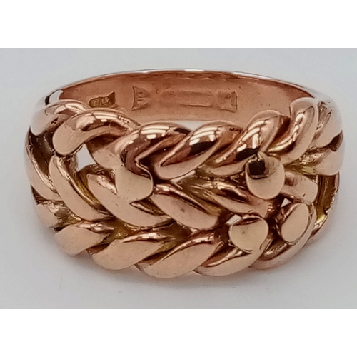 220 - A 9K ROSE GOLD KEEPER RING. TOTAL WEIGHT 7.8G. SIZE N/O.