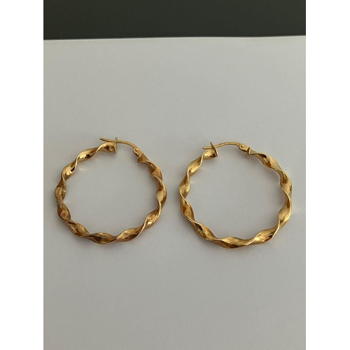 307 - Hallmarked 9 carat GOLD twisted hoop earrings. 1.24 grams. 3 cm diameter.