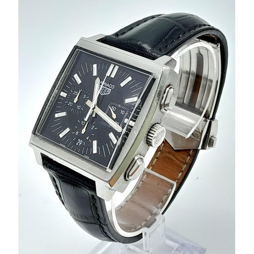 46 - A Tag Heuer Monaco Chronograph Quartz Gents Watch. Black leather strap. Stainless steel case - 38mm.... 