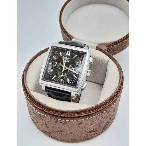 46 - A Tag Heuer Monaco Chronograph Quartz Gents Watch. Black leather strap. Stainless steel case - 38mm.... 