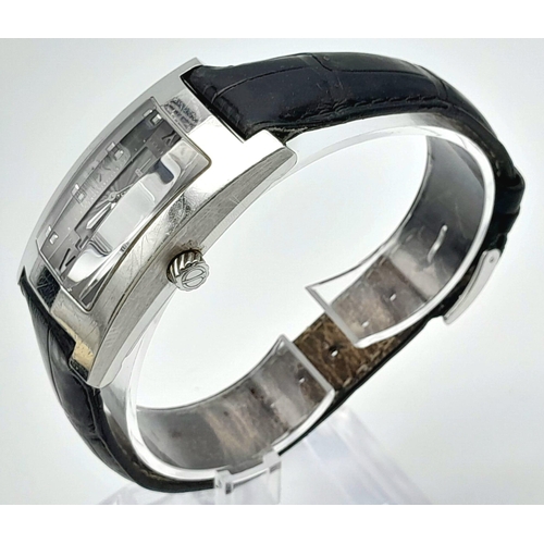 67 - A DUNHILL STAINLESS STEEL TANK STYLE WATCH WITH FACETED GLASS FACE ON A BLACK LEATHER STRAP .  25 X ... 