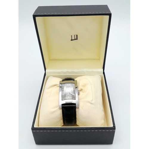 67 - A DUNHILL STAINLESS STEEL TANK STYLE WATCH WITH FACETED GLASS FACE ON A BLACK LEATHER STRAP .  25 X ... 