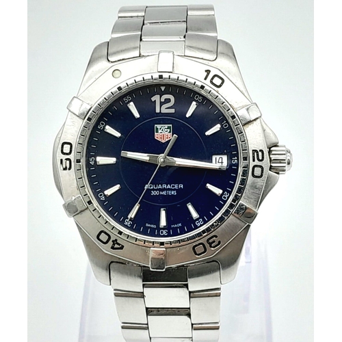 74 - A Tag Heuer Aquaracer 300M Quartz Gents Watch. Stainless steel strap and case - 39mm. Blue dial with... 