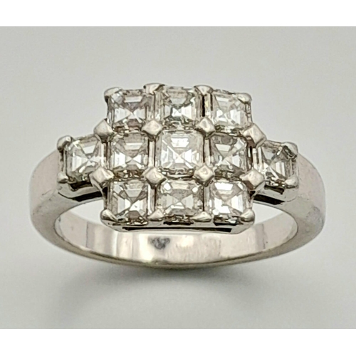 107 - A 950 Platinum and Diamond Ring. Eleven princess cut diamonds. 2.2ctw approx. Size O. 7.23g total we... 