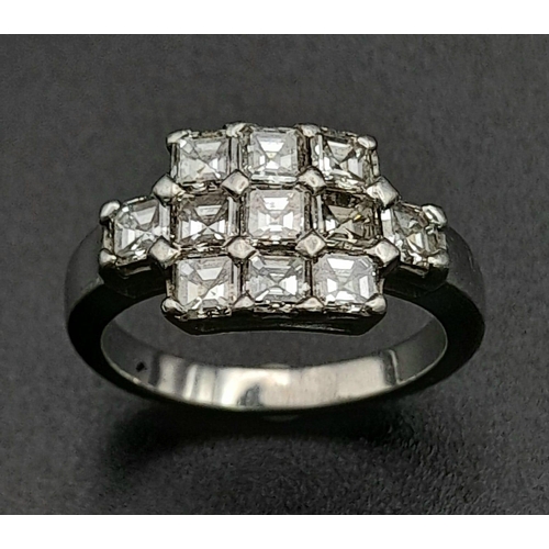 107 - A 950 Platinum and Diamond Ring. Eleven princess cut diamonds. 2.2ctw approx. Size O. 7.23g total we... 