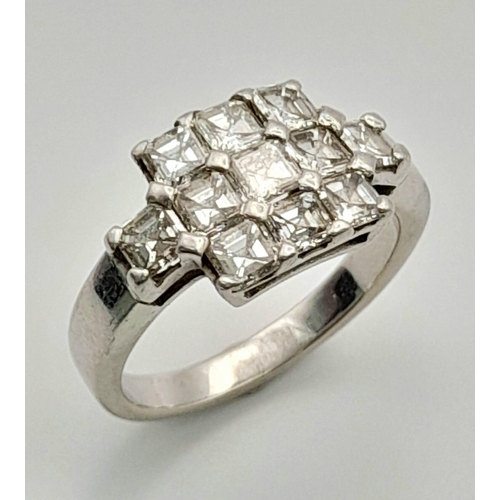 107 - A 950 Platinum and Diamond Ring. Eleven princess cut diamonds. 2.2ctw approx. Size O. 7.23g total we... 