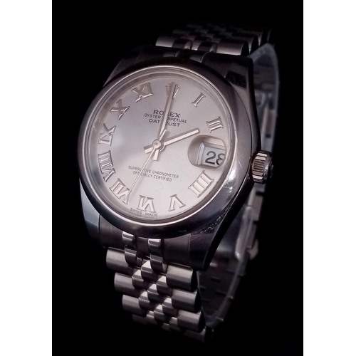 151 - A  ROLEX OYSTER PERPETUAL DATEJUST IN STAINLESS STEEL WITH SILVERTONE DIAL , ROMAN NUMERALS AND WITH... 